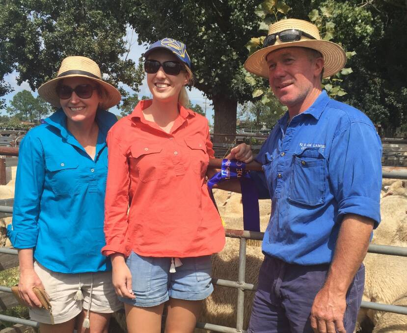 Angela Landers with Melanie Landers (Miss Showgirl 2017 Glen Innes) and Rob Landers at the Yasloc sale, pleased with their win and subsequent auction of stock.