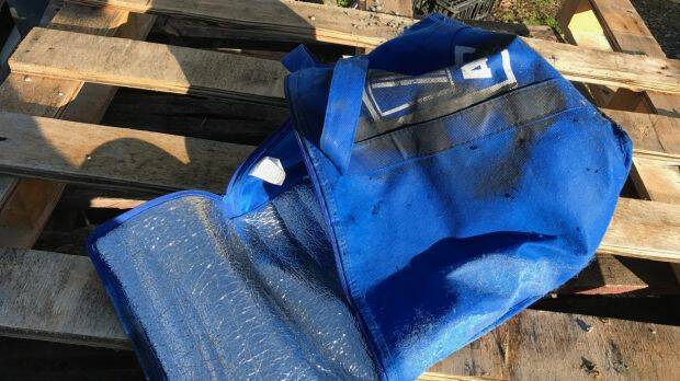 This bag, containing a severed pig's head, was left at the front gate of the Islamic College of Brisbane on Wednesday morning. Photo: Supplied