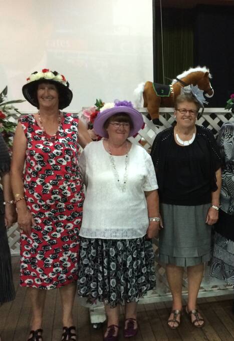 Dressed to impress: Contenders at last year's fashions on the field competition at the Services. Theme this year is Oaks Day and there will also be a trivia quiz.