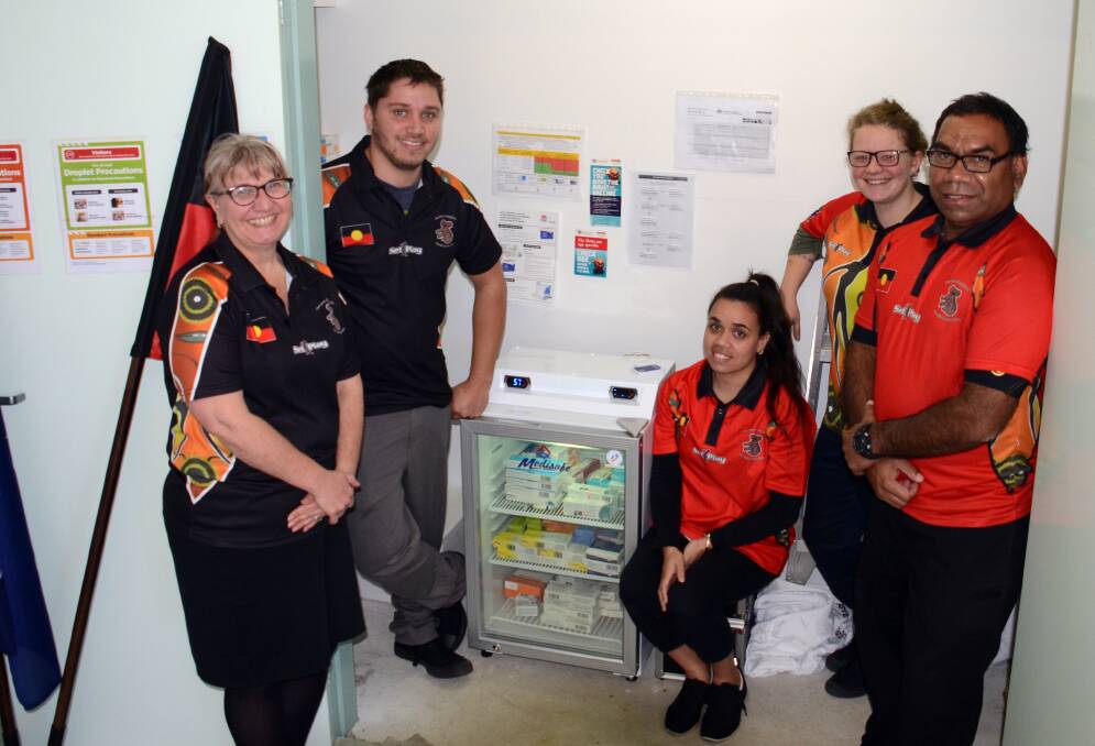 NEW FRIDGE: RN Sara McGregor, Tim Bell-Levy, Lianna Fuller-Byrne, Josey Peterson and James Speedy with the new fridge which has been freshly stocked at Armajun on Monday. Photo: Rachel Baxter.