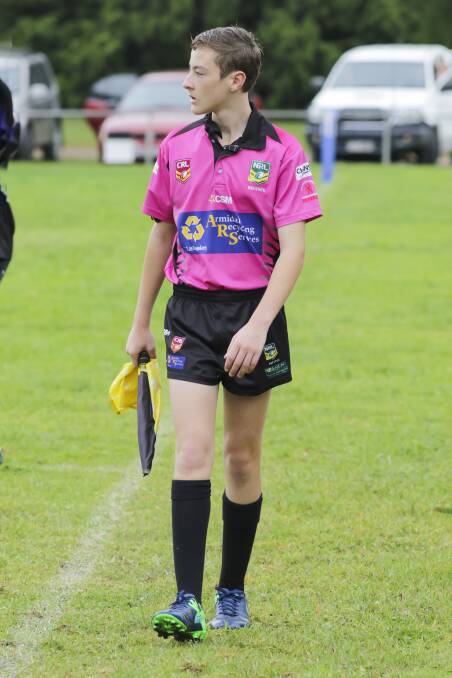 Connor Cooke officiates as a touch judge during a senior Group 19 rugby league game. 