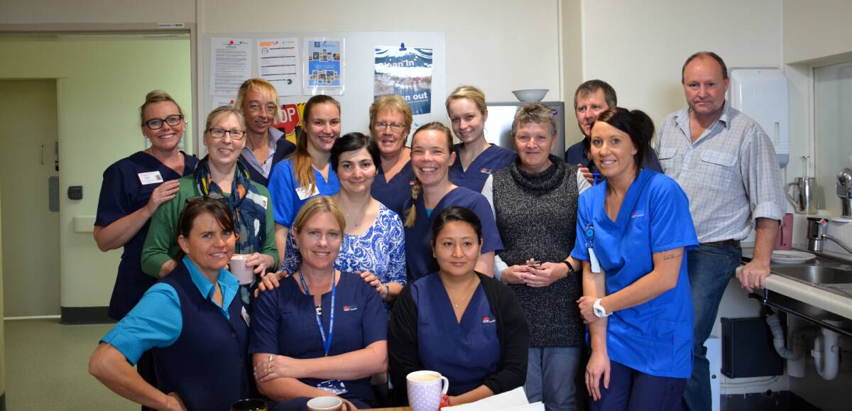 WILL BE MISSED: Staff gathering in the morning tea room at the Glen Innes Hospital on Wednesday morning to dig into some delicious cakes cooked by Dr Azar, and to say goodbye. Photo: Rachel Baxter.