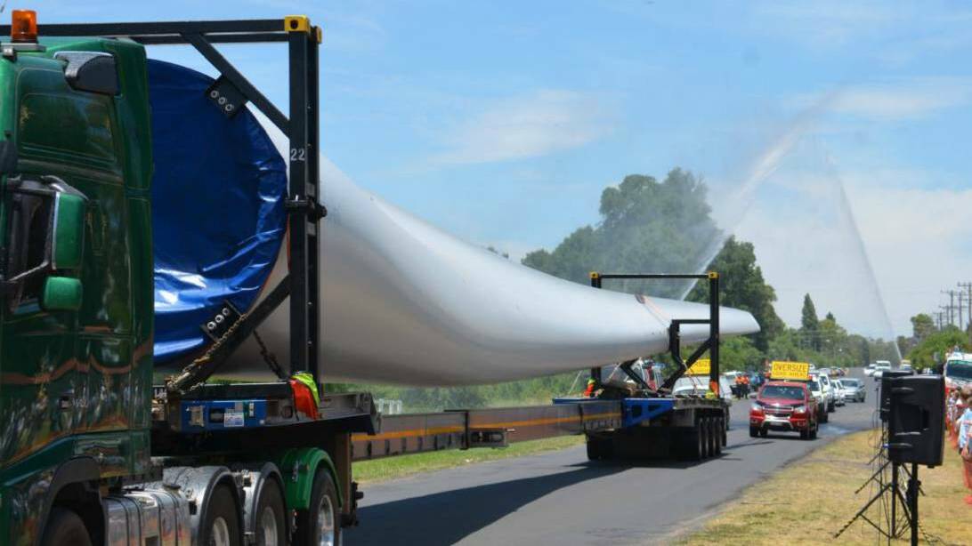 SAFETY ALERT: Turbine blades en route to the wind farm earlier this year. A trade union has slammed Goldwind Australia for unsafe work practices after three workers were injured in a single-vehicle rollover at White Rock Wind Farm on Monday.
