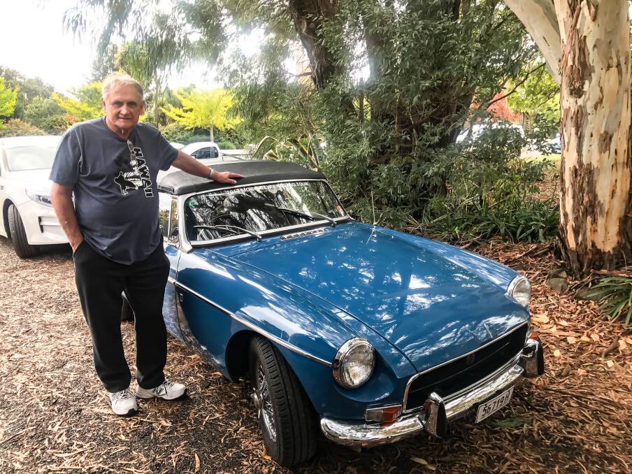 Bobs Dabbs with his blue MGB 1972 vintage car at the Super Strawberry.