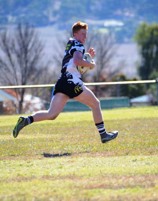 FLYING: Alex Fisher flying down the field to score - All Magpie minor league age groups are into the 2016 semi finals
