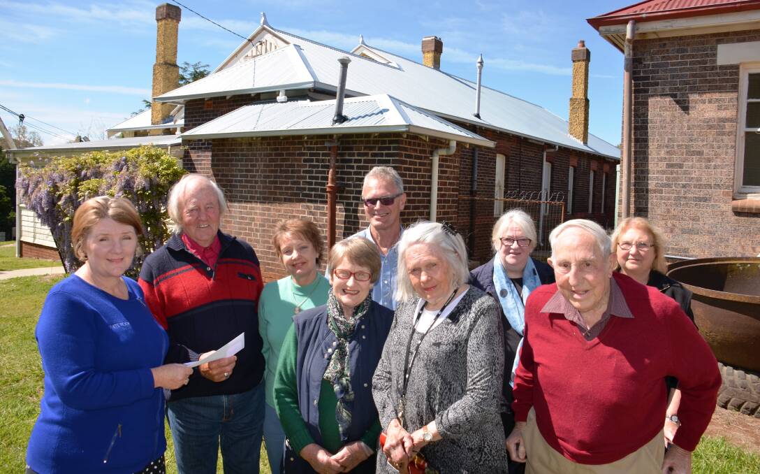 FINISH OFF FUNDS: Goldwind Australia local representative Sandra Royal (left) hands over a $4000 cheque to Historical Society members.