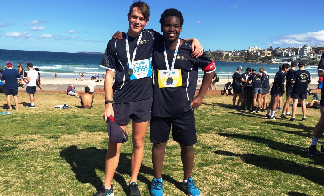 CITY 2 SURF: Saxon Hughes and Mike Nyathi put in a fantastic effort to complete the City to Surf footrace in Sydney on Sunday.
