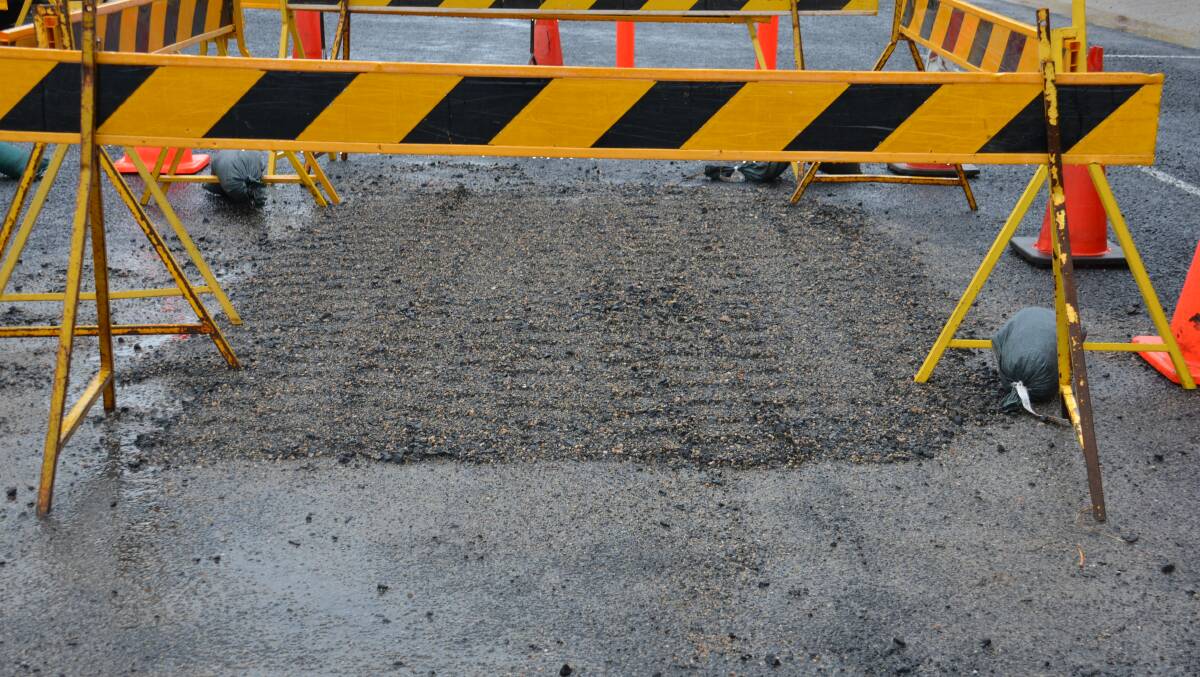 SINKING FEELING: A minor sinkhole on Bourke Street that was caused by heavy rainfall last week was filled in by council