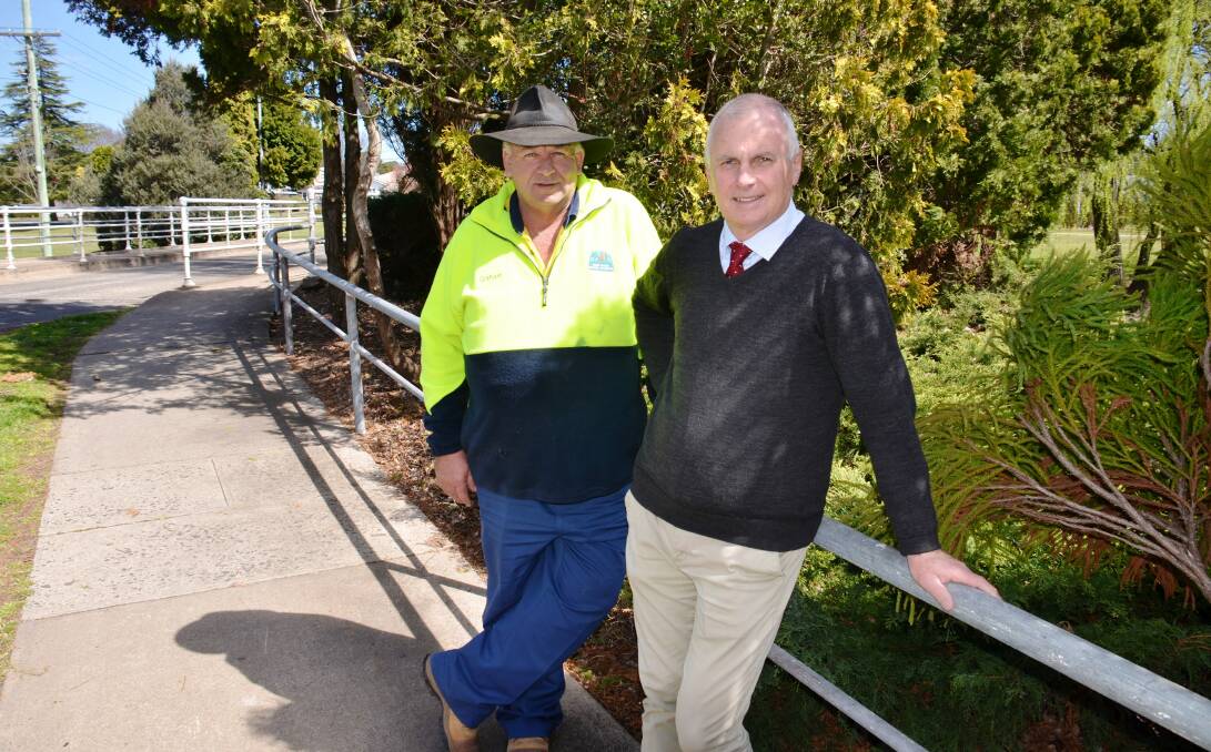 COMMUNITY WORK: Graham Archibald and Graham Price at one of the work for the dole sites on Bourke Street.