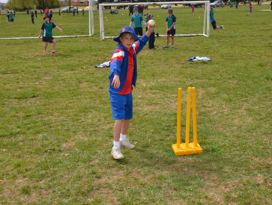 THROWING THEM DOWN: Danny Daley, from Year 4 at St Joseph's, about to throw the ball.