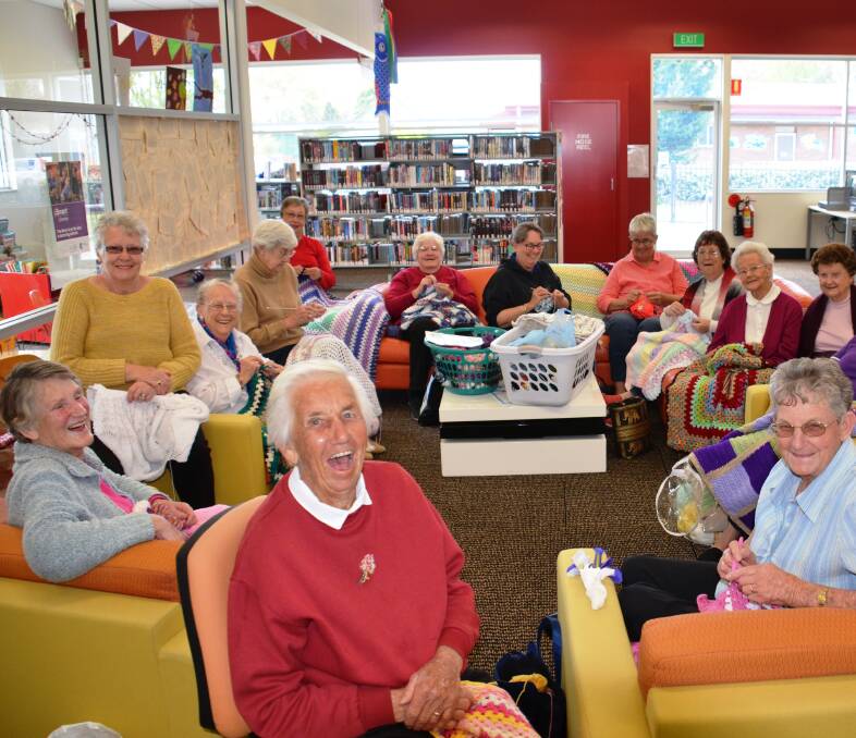 LOVE: The Glen Innes wraps with love team all smiles after a big knitting season.
