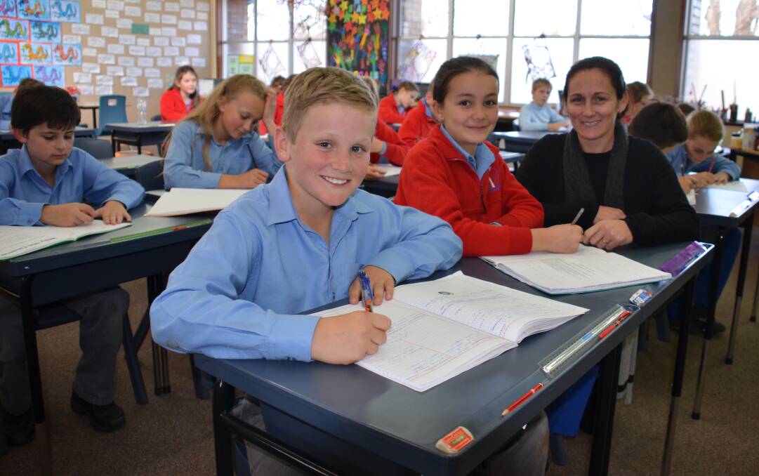 George Matthewson and Halle Sharman, together with their teacher Casey Chard, were all part of the team that achieved outstanding results for St Joseph's in the latest NAPLAN tests.