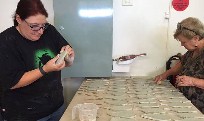 Helen Lawler and Carol Sparks working on the tiles.