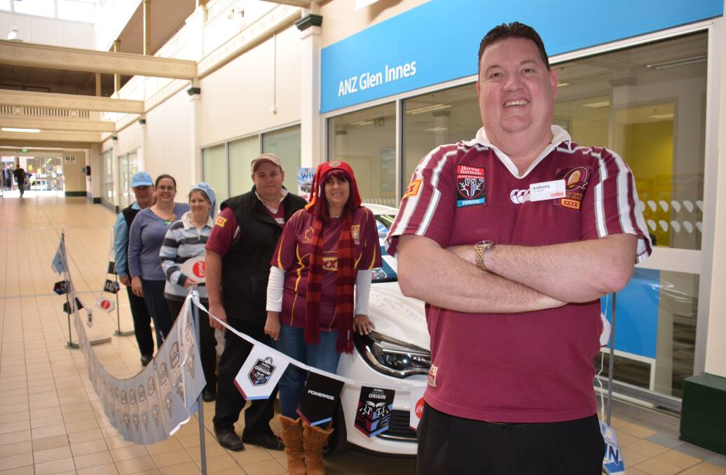 Goles Glen Innes manager Anthony Veldhuizen and team members (from back) Linda Cresnik, Tracey Carpenter, Debbie Mepham, Chris Marshall and Leanne Parker would love to see the car go to a local.