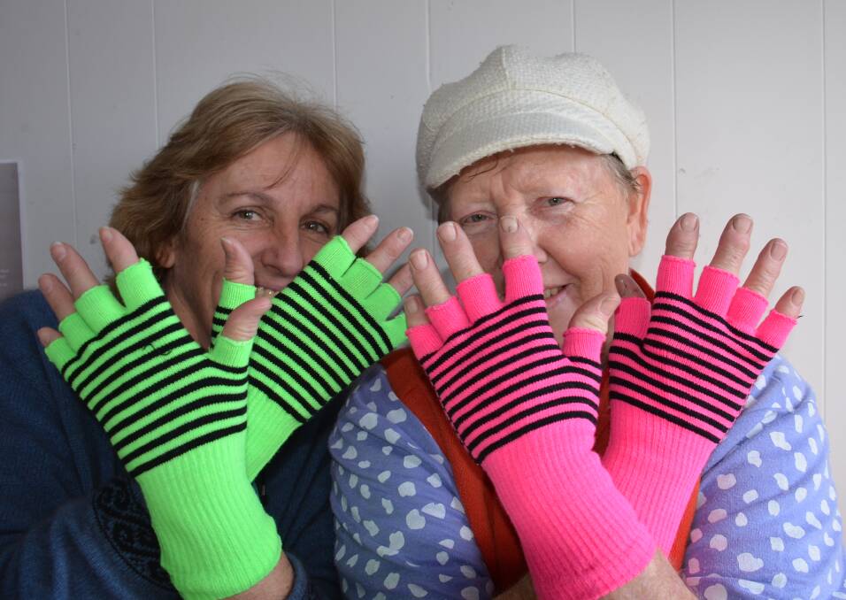 Glen Innes CanAssist's Maryn Burgess and Fay Burgess model the funky gloves.