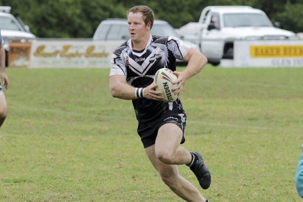 UP AGAINST IT: Brendon Blaker on the run for the Glen Innes Magpies at Mead Park on Sunday against the MacIntyre Warriors. Photo: Tony Grant. 