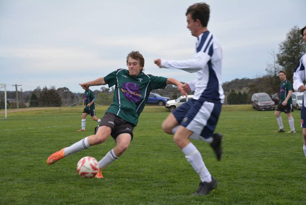 BOOT TO BALL: Blake Hayden gets a kick away in the grand final against The Armidale School. 