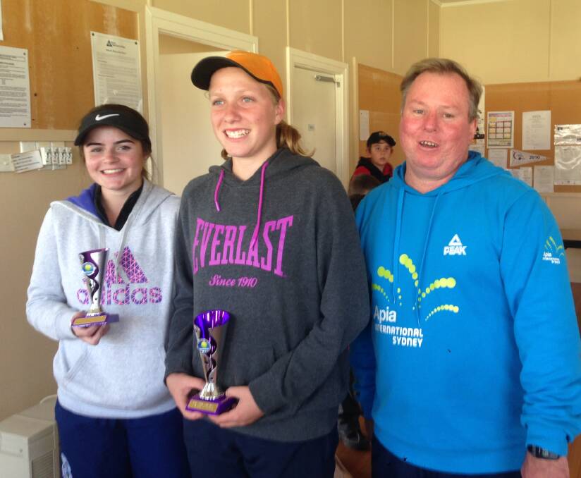 TROPHY HOLDERS: Under 16 players Sara Campbell, Jane Ervine with event organiser Rickie Withers.