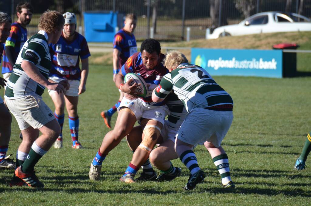 BUSTLING RUN: Glen Innes-Guyra's Sione Tanguly runs into the Robb College defence.