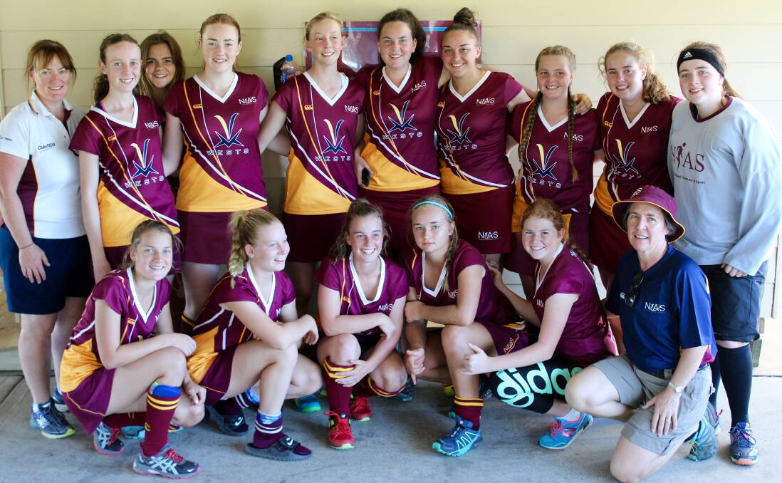 Third place: The NIAS girls hockey team come together for a photo after finishing third in the Academy Games on the Central Coast.