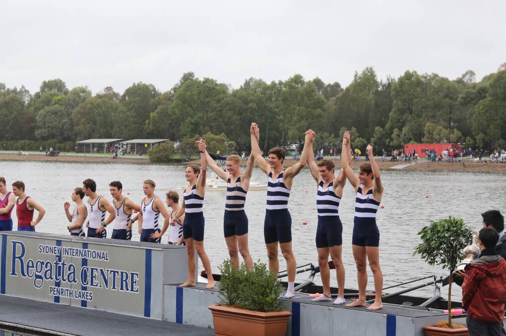 Top effort: Glen Innes brothers Henry Hughes (left) and Saxon Hughes (right) celebrate their podium finish alongside teammates at the Head of the River in Sydney.