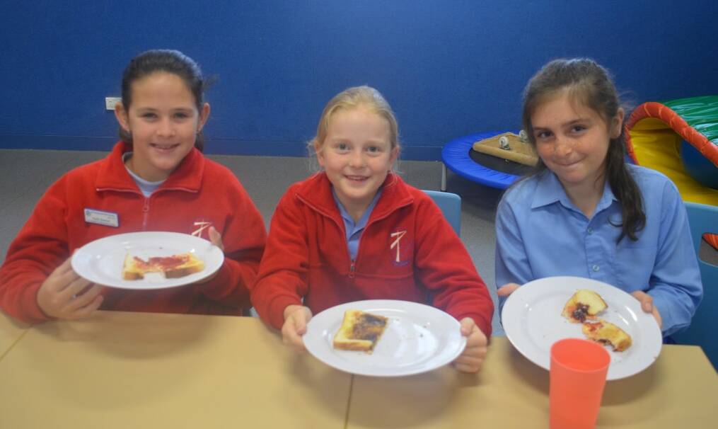 MUNCH MEET: Year 5 students Kadia Spencer, Breanna Donnelly and Monica Newsome all love coming to breakfast club.