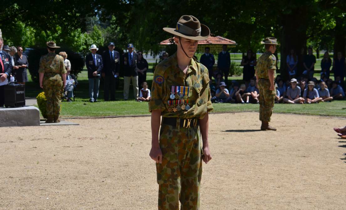 Glen Innes cadets form a catafalque guard around the Anzac Park cenotaph, as the community paused to reflect on Remembrance Day.
