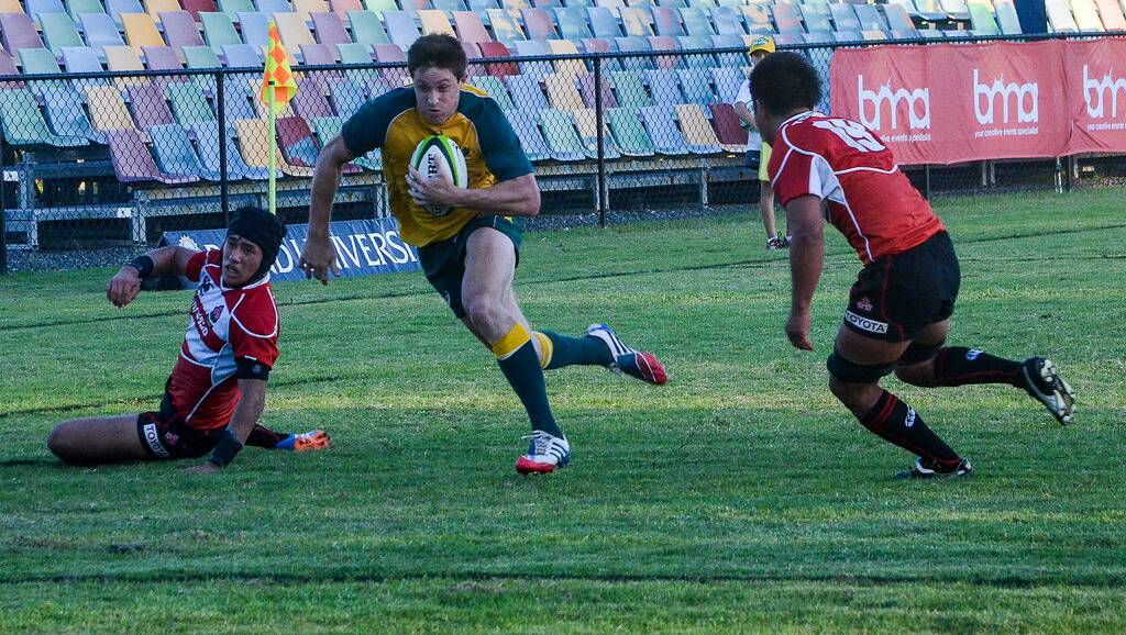 Newsome scoring a try against Japan at the Oceania Junior Rugby Championship. Photo by HJ Nelson