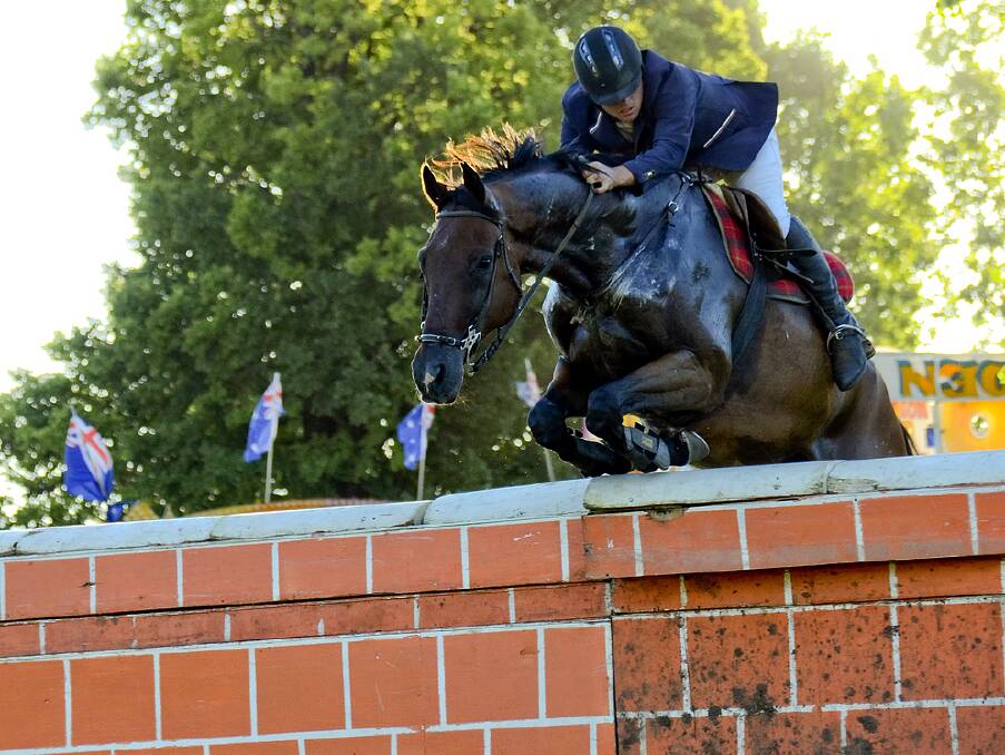 Brock Everingham makes it over the brick wall at the inaugural Glen Innes Spring showjumping event last year. 