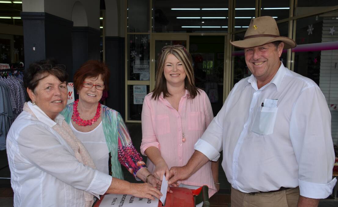  L to R Moira Munro, Pattie Williamson, mel Lindsay and Jim Ritchie place a sales docket in a 'spend in glen' bin.