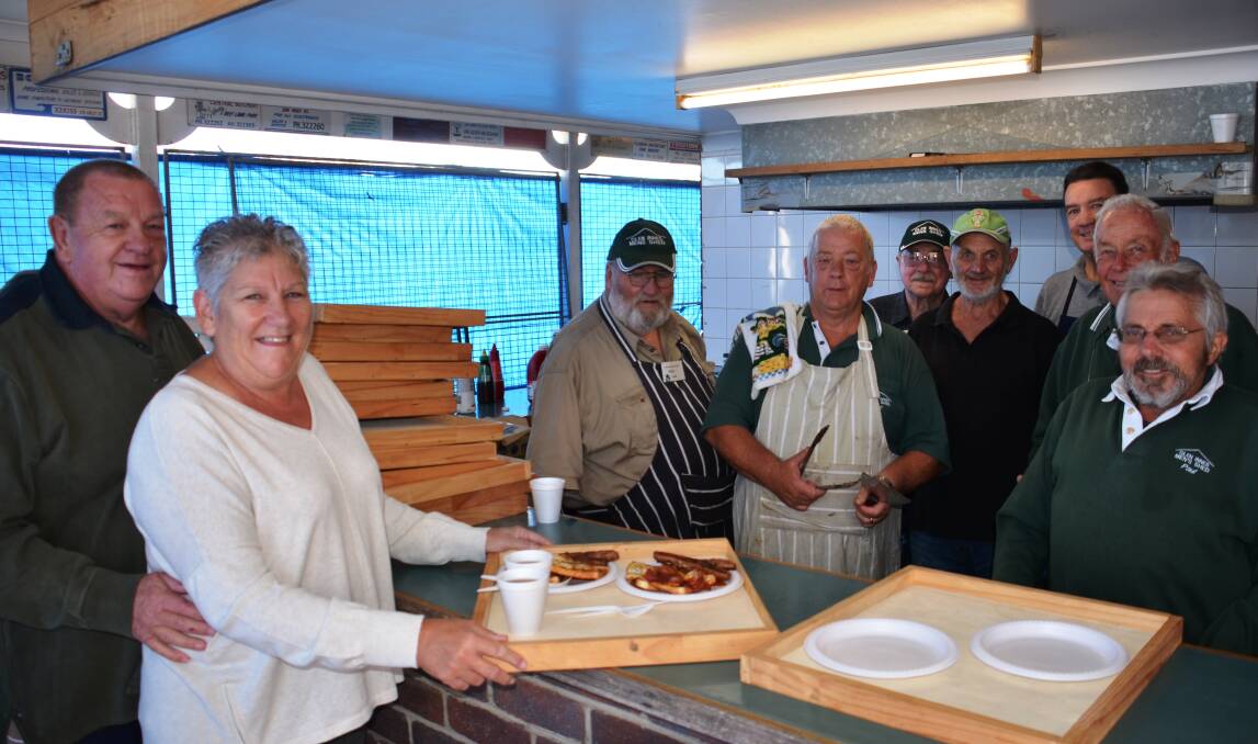 HUNGRY: The men’s shed crew served up more than 400 breakfasts over the festival weekend including multiple visits from  Alexis and Al Dent from Tamworth.