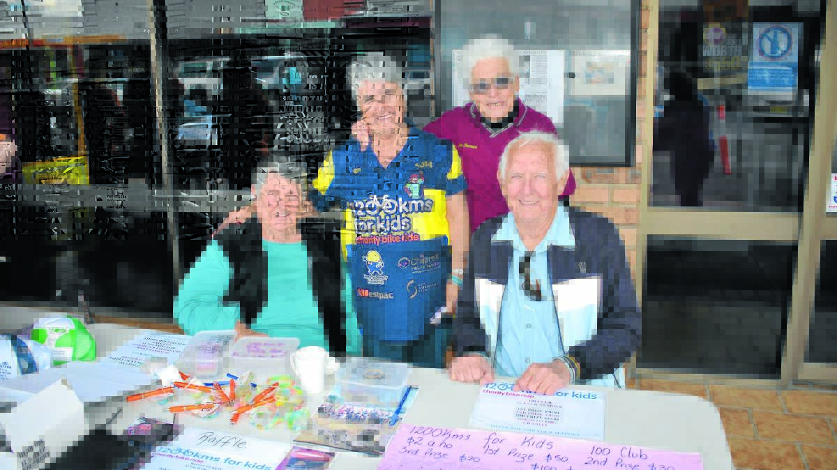 o Common goal: Cyclists support person Gail Ryan catches up with local hospital fundraisers Jan Sharman (standing) and Doreen and Noel Bourne (seated).