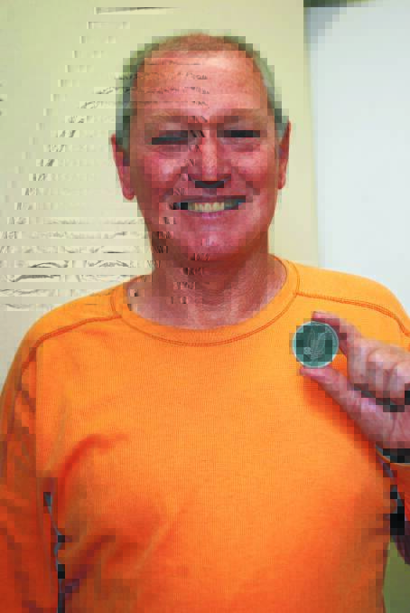 o  Gordon Taylor with the medallion presented to him for his support.