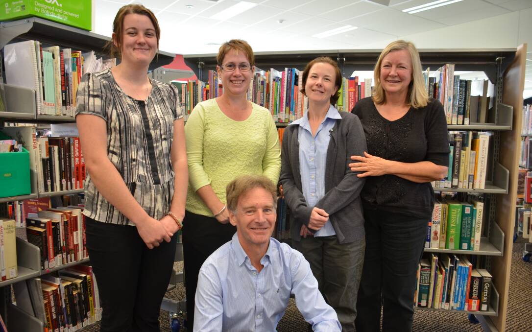 o Library lovers: Glen Innes Library staff members Navanka Fletcher, Kate Cooper, Alex Sanderson, Kerry Byrne and Phil Hine are keen to see the balance of local and state government funding return to regional libraries to develop thriving community social spaces.