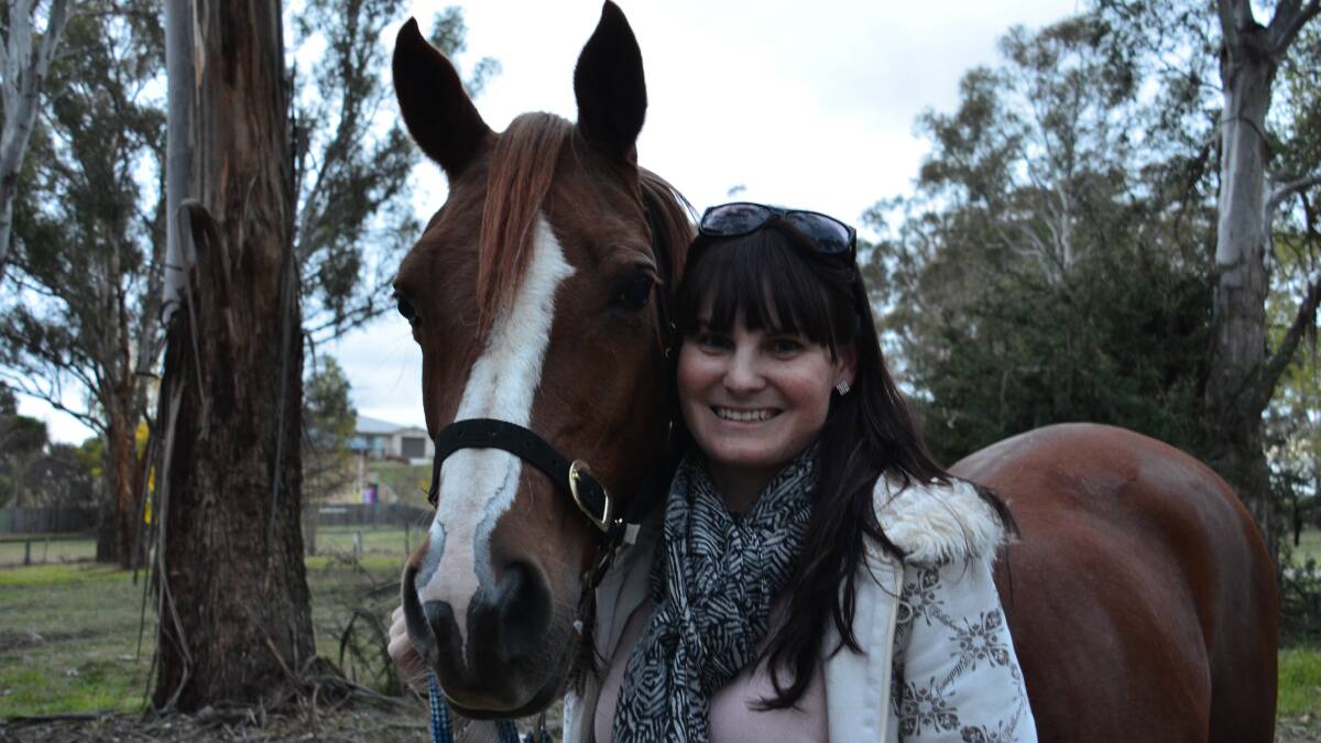 o Long road to the games: Jennifer Annetts and Churinga Goldfire (‘Goldie’ to her friends) are a common sight in training on local rural roads as Jennifer prepares for the World Equestrian Games.