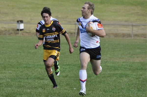 o Break: Brett Stapleton in action against Tenterfield, he booted three goals on Saturday. Obscured is Daniel Sharman.