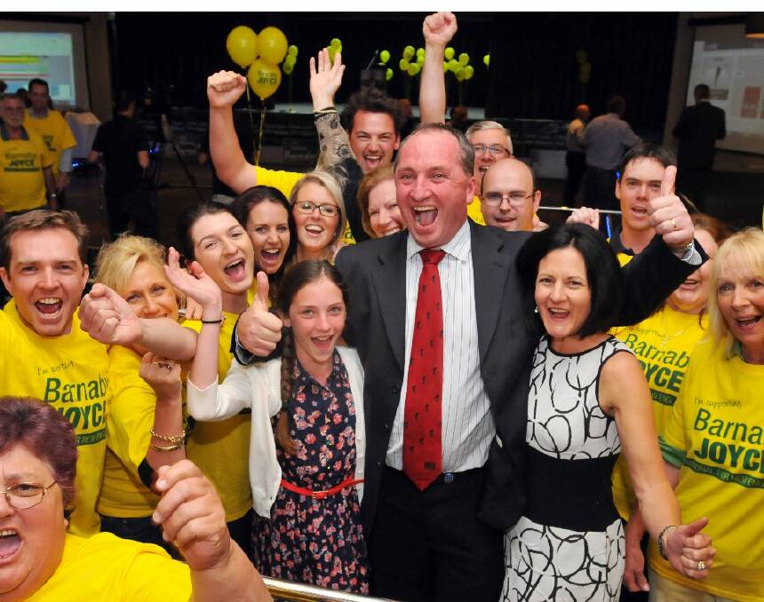 o Cheers: Barnaby Joyce and family members celebrate his victory on Saturday night surrounded by his ‘killer canaries’. Photo courtesy of Northern Daily Leader.