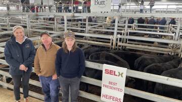 Sally Butt, Butt Livestock, with Steve and James Faulder, Yass, and their best presented heifers of 12 Angus heifers which sold for $1890