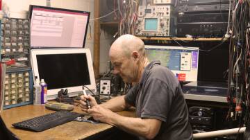 Dene Bourke soldering in his workshop. Dean has owned the same business for over 30 years. Picture by Heath Forsyth 