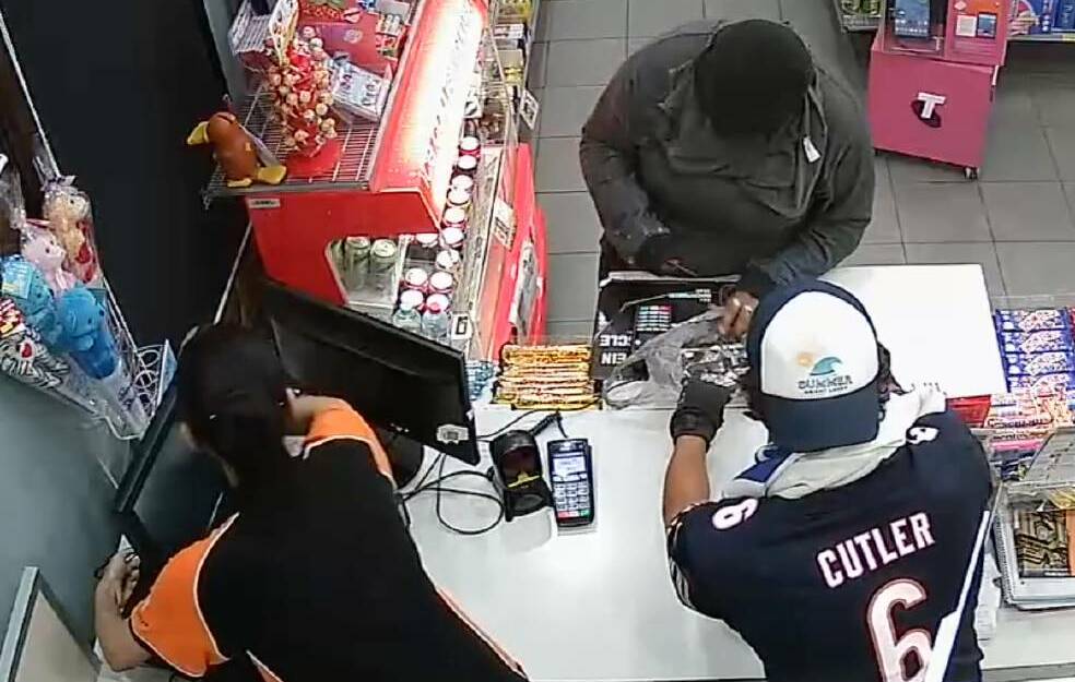 Hold-up: The CCTV images of the hold-up inside the Shell service station in Glen Innes on January 29 . Photos: Supplied