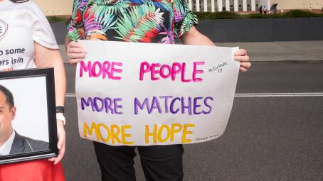 A sign calling for funding to the Australian Bone Marrow Donor Registry. Picture by Sitthixay Ditthavong