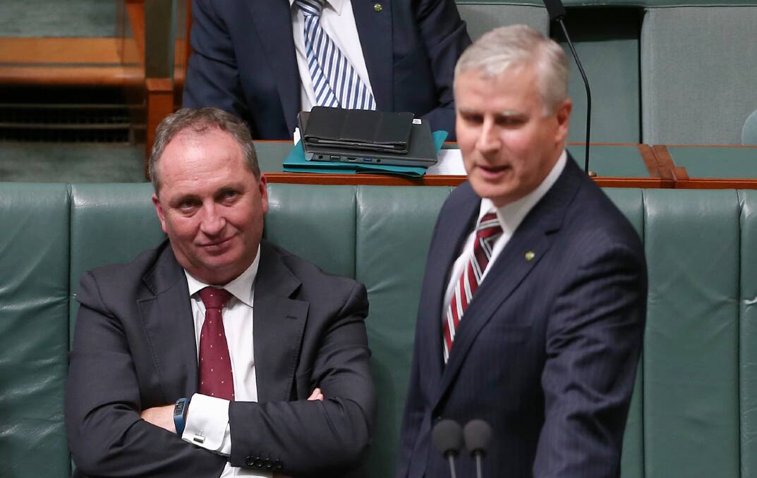Agriculture Minister Barnaby Joyce listen as Assistant Minister to the Deputy Prime Minister Michael McCormack delivers a statement on outgoing Nationals leader Warren Truss in 2016. Picture: Alex Ellinghausen