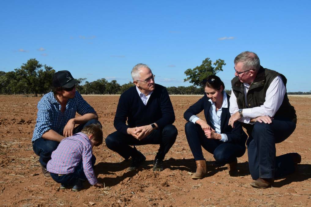 DRY TIMES: At Trangie, farmers Phil and Ashlea Miles and son Jack met with Prime Minister Malcolm Turnbull and Parkes MP Mark Coulton, among others. Photo: Belinda Soole