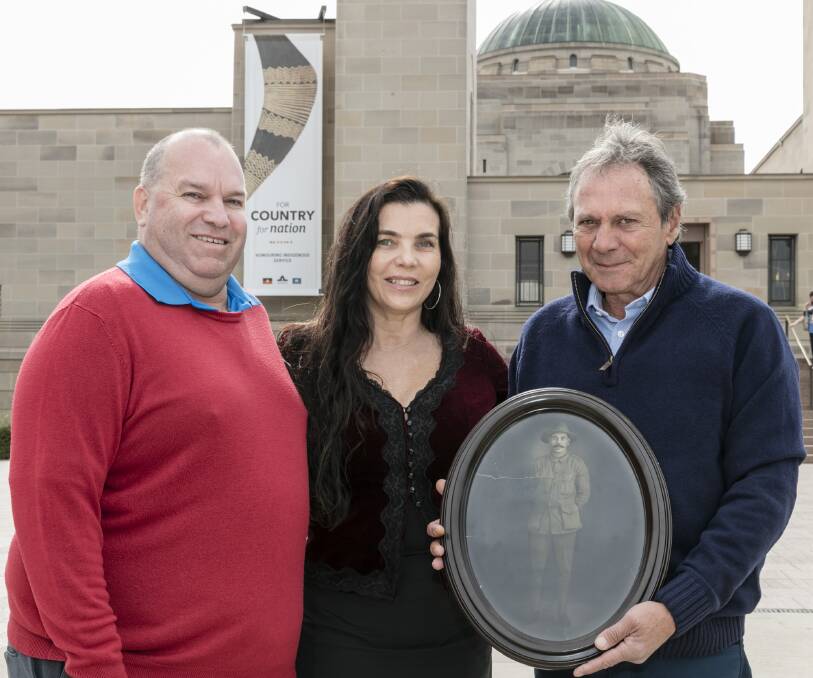 In honour: The Australian War Memorial's Aboriginal Liaison Officer and fellow Gomeroi man Michael Bell with Michelle Flynn and Peter Milliken at the opening of the For Country, For Nation exhibit.