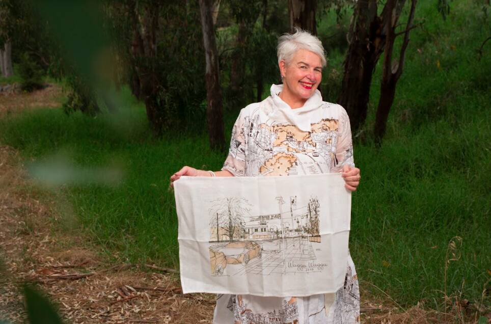 Temora artist Joanne Woods with her Wagga themed tea towel. Photo: Madeline Begley
