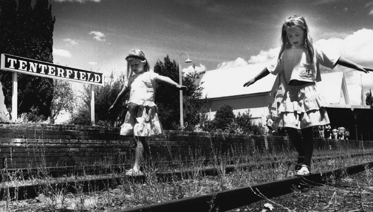End of the line..Sally Morris and Michelle Summers, both 6, play on the disused railway tracks after the last train departed Tenterfield in 1989.