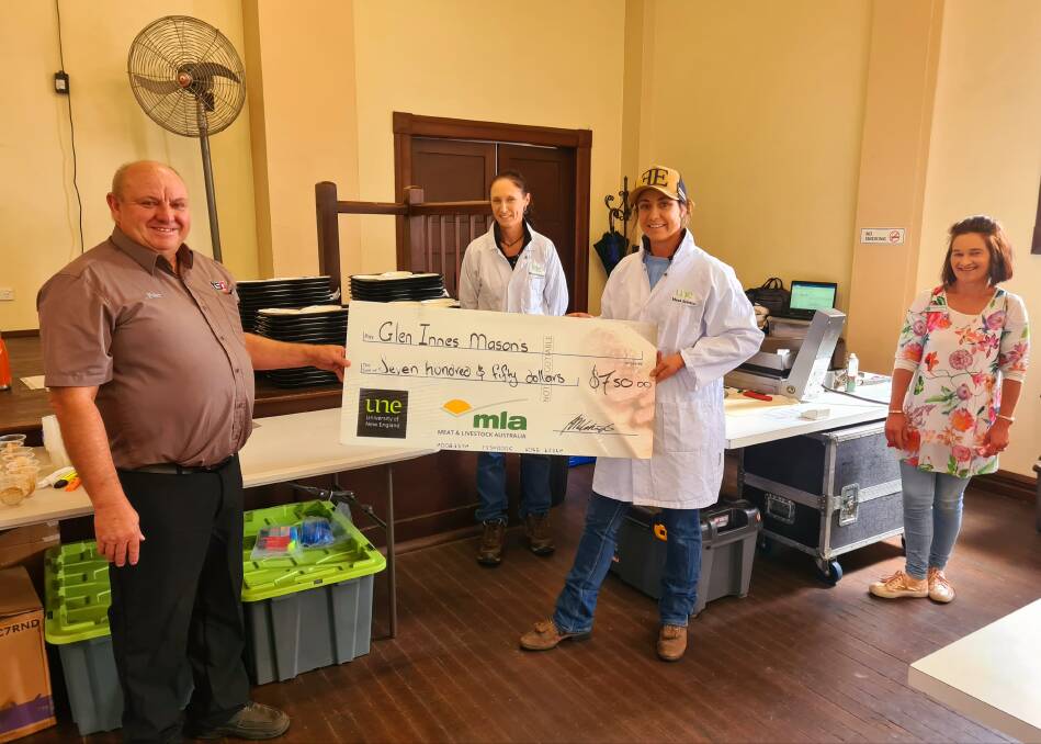 MEAT TASTING: Peter Davis from Glen Innes Masons accepts the cheque from Andrea and Ashley from the UNE Research team, alongside Mary Hollingworth from Guyra CWA.