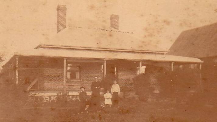 Christina Kay with the children at the manse beside St Andrews Presbyterian Church, now part of the Public School.