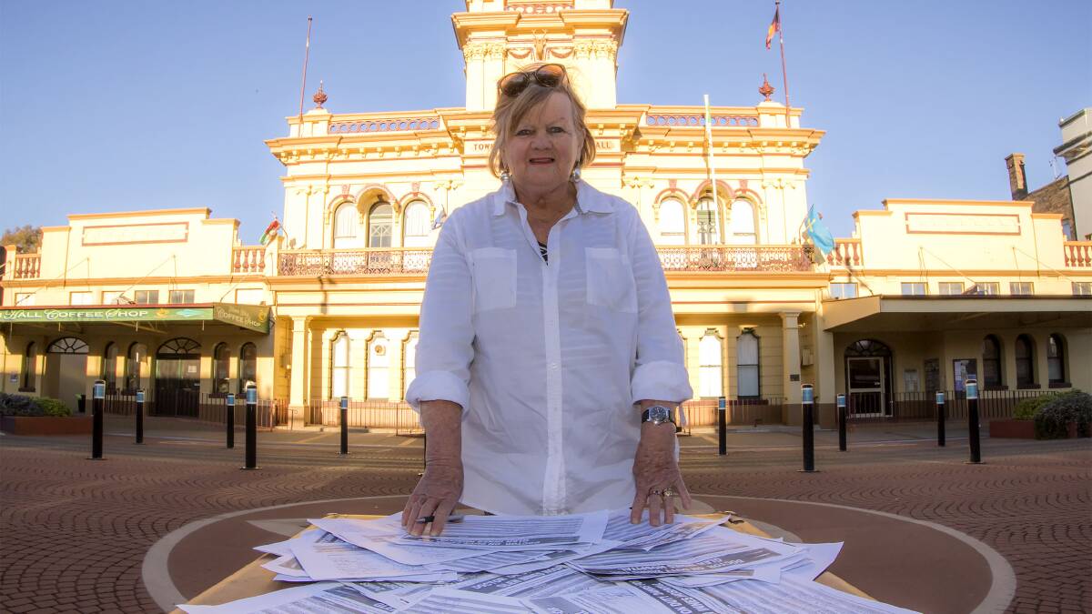 Carol Sparks with the petition she started from Dawn Walker MP, urging the state government to have a doctor on call at Glen Innes Hospital at all times.