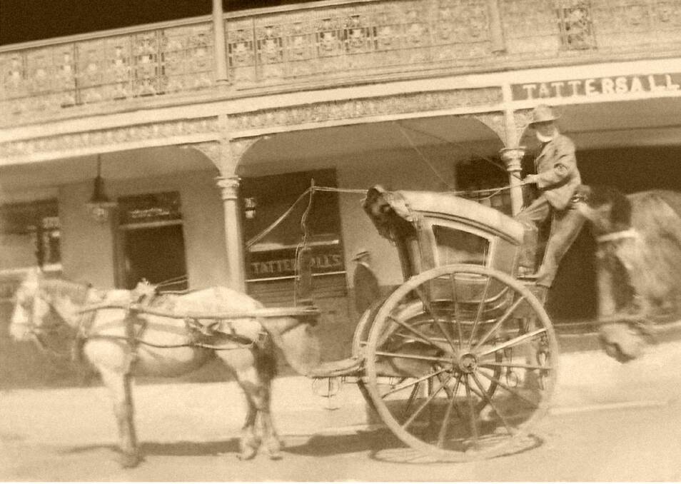 DRIVER: Larry Madden, a former Cobb & Co coach driver, with his Hansom cab outside the Tattersalls Hotel in Grey Street. Picture: Supplied
